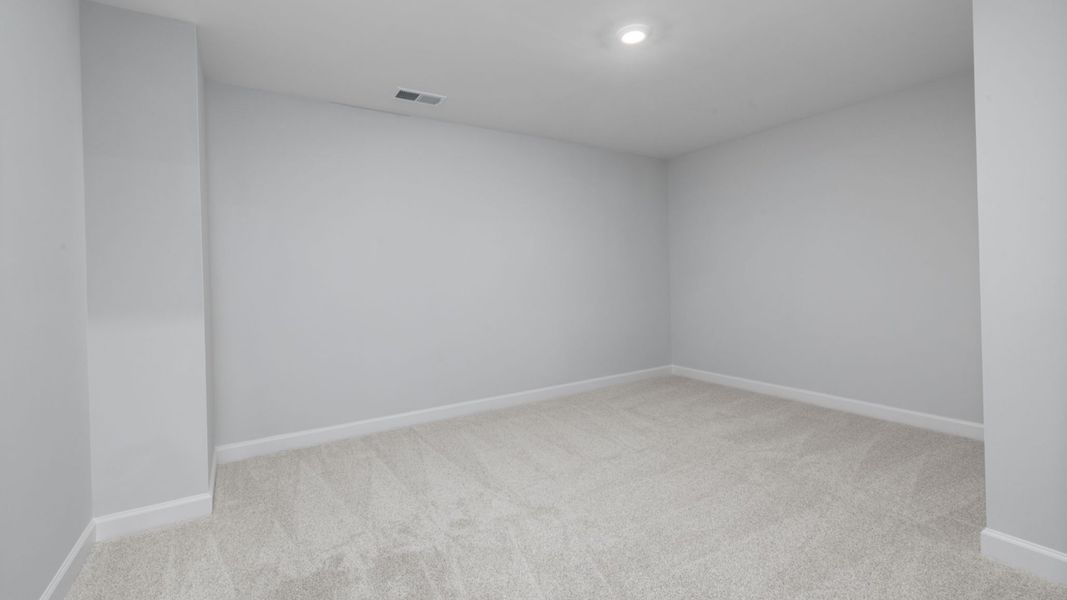 Spacious, unfurnished interior of a new home in The Courtyards at Oak Grove, Durham (Image 36).
