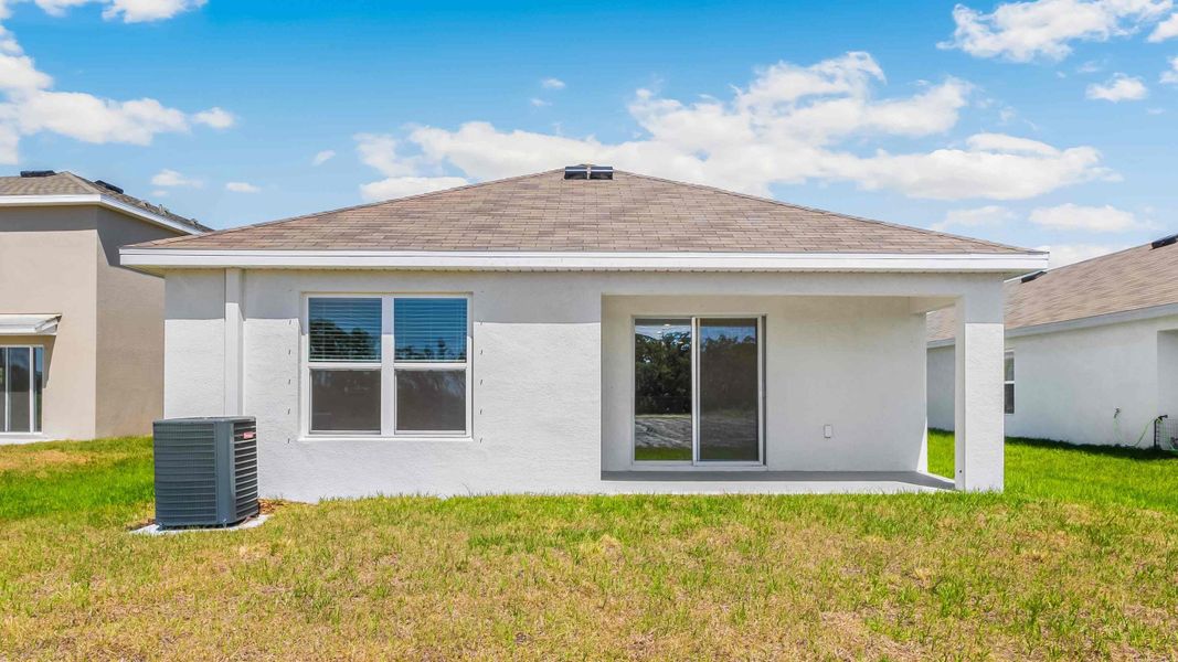 Representative exterior photo of a completed home built from the Allex by D.R. Horton in Oakfield Lakes, Parrish, FL (Image 18).