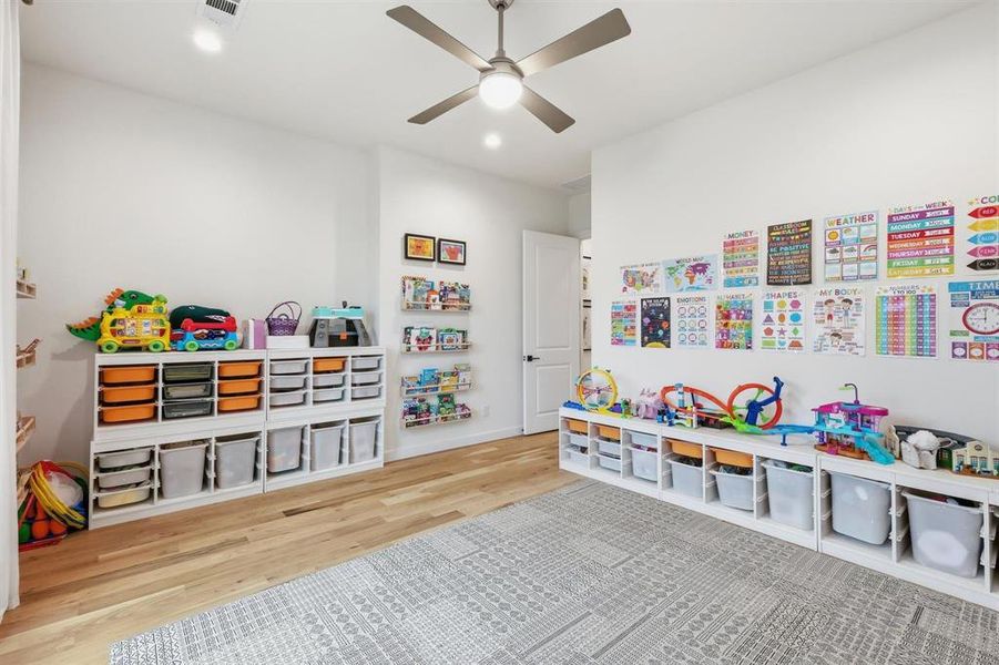 Rec room featuring ceiling fan, light wood-style floors, and recessed lighting