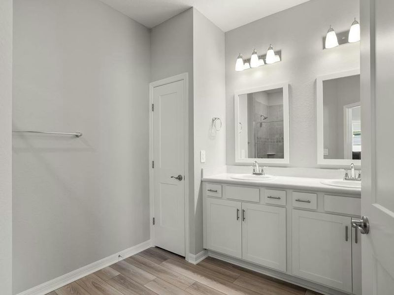 Your suite is complete with a walk-in wardrobe and a large en-suite bath with a tiled shower.
