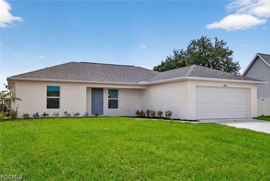 Front exterior of a new home in Cape Coral, Cape Coral, FL, highlighting curb appeal (Image 2). Front exterior of a new home in Cape Coral, Cape Coral, FL, highlighting curb appeal (Image 2).