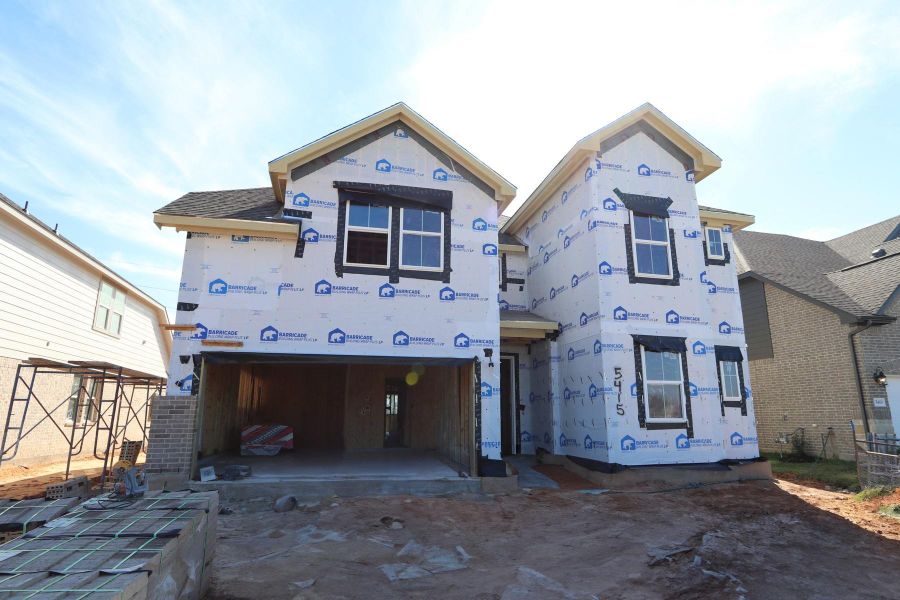 Two story home with 5 bedrooms, 4.5 baths, and 3 car tandem garage.