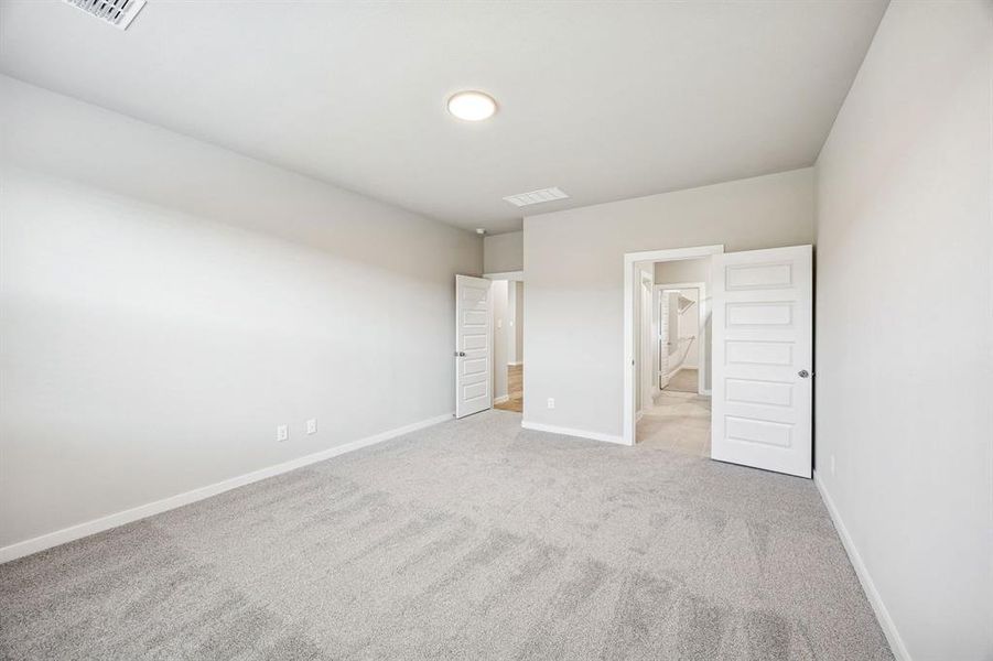 Primary Suite in the Willow home plan by Trophy Signature Homes – REPRESENTATIVE PHOTO