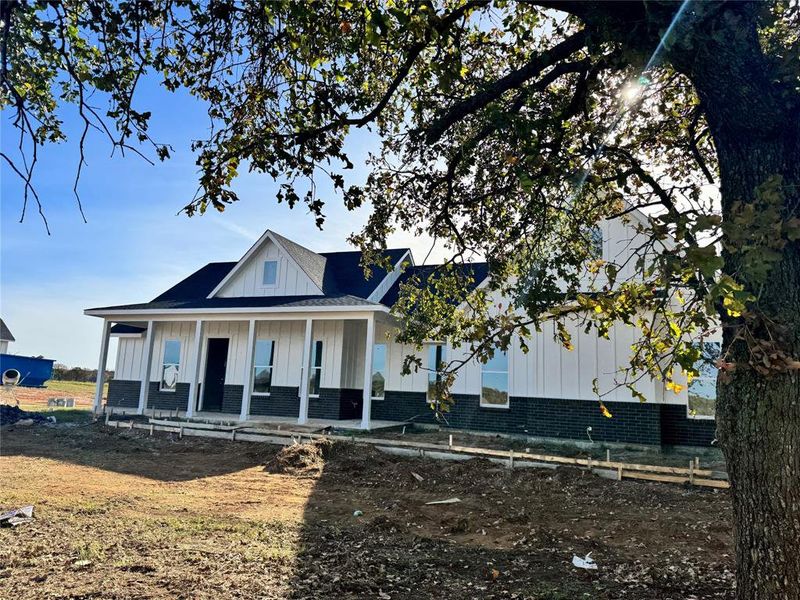 View of front facade featuring covered porch