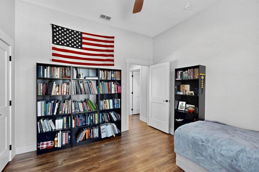 Bedroom featuring wood finished floors and a ceiling fan