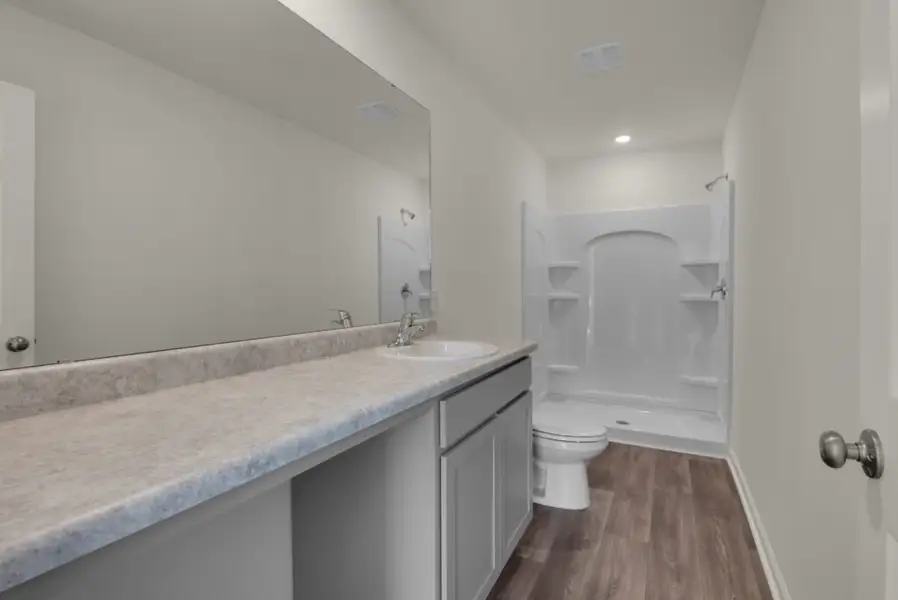 Representative furnished interior of a home built from the Maddox by Holiday Builders in Floridatown, Pace (Image 4).