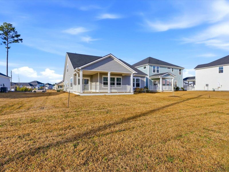 Exterior details and patio area of a home in The Coves at Lakes of Cane Bay, Summerville (Image 24).