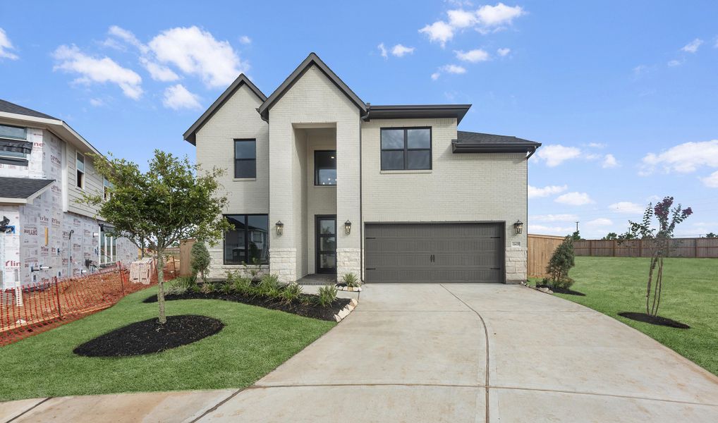 Front exterior of a new home in Jordan Ranch, Katy, TX, highlighting curb appeal (Image 2). Front exterior of a new home in Jordan Ranch, Katy, TX, highlighting curb appeal (Image 2).