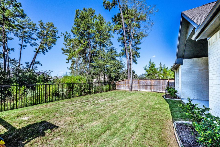 Exterior details and patio area of a home in , Conroe (Image 25).
