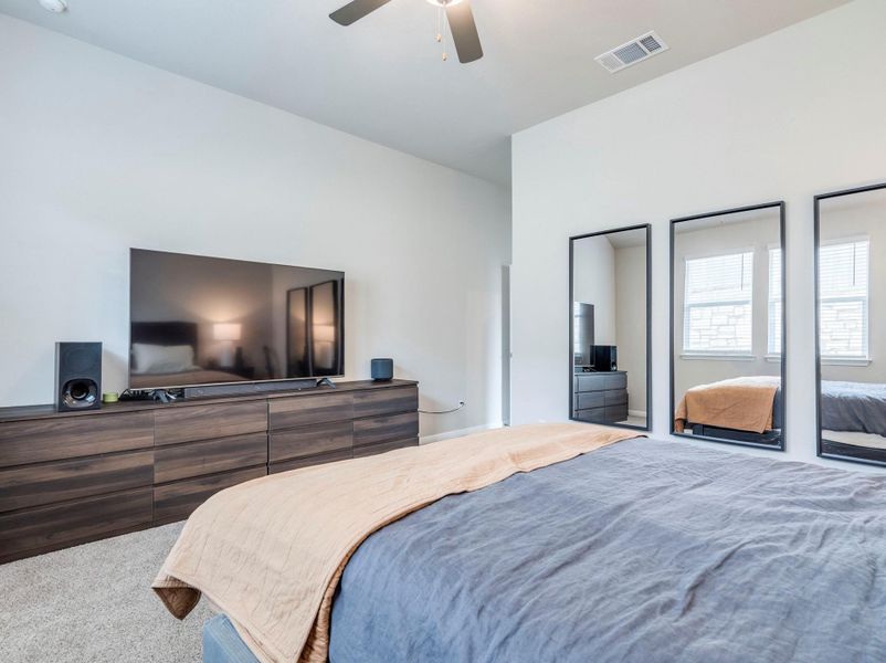 Primary bedroom situated from other bedrooms at the backyard with generous ceiling height to create an inviting and comfortable bedroom retreat.