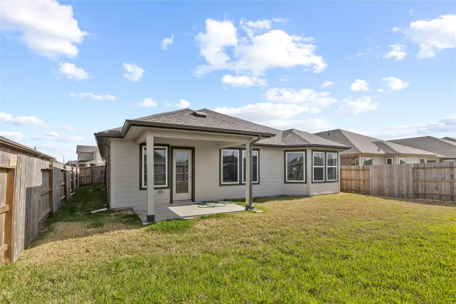 Exterior details and patio area of a home in Wall Street Village, Richmond (Image 3).