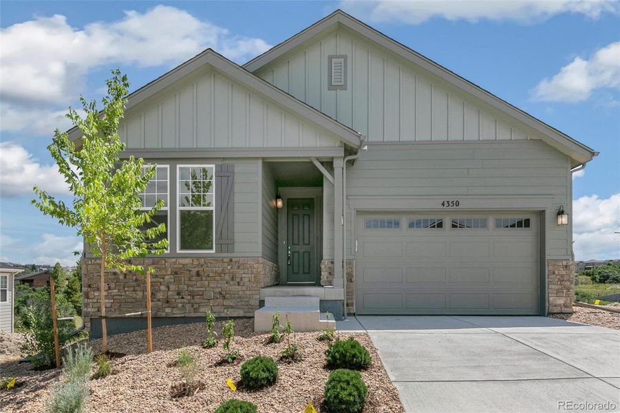 Front exterior of a new home in Terrain Oak Valley, Castle Rock, CO, highlighting curb appeal (Image 23).