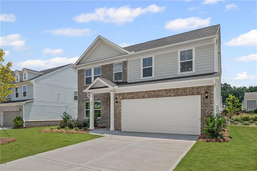 Front exterior of a new home in Hawthorne Ridge, McDonough, GA, highlighting curb appeal (Image 17).