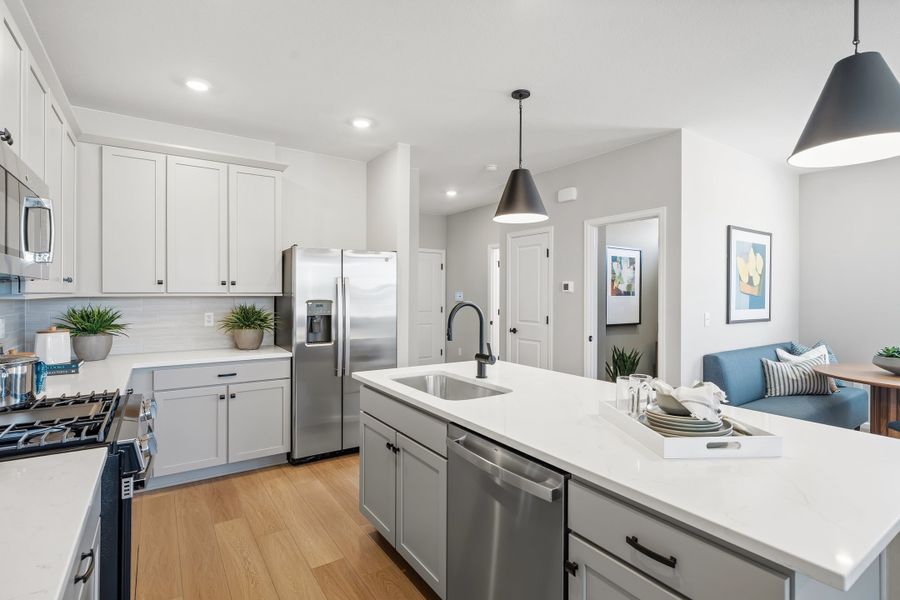 Representative furnished interior of a home built from the 2403 by Risewell Homes in Harvest Crossing, Aurora (Image 5).