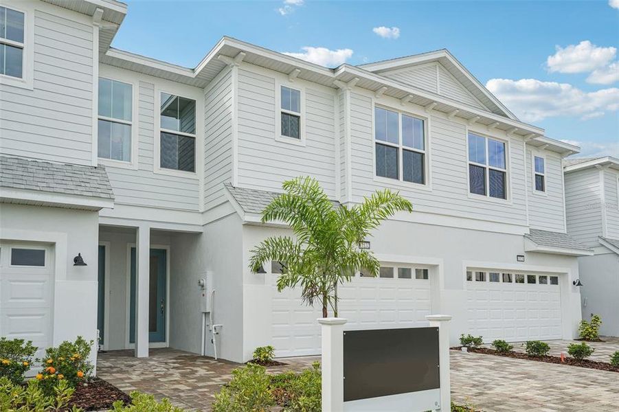Front exterior of a new home in Isla Mirada, San Antonio, FL, highlighting curb appeal (Image 1).