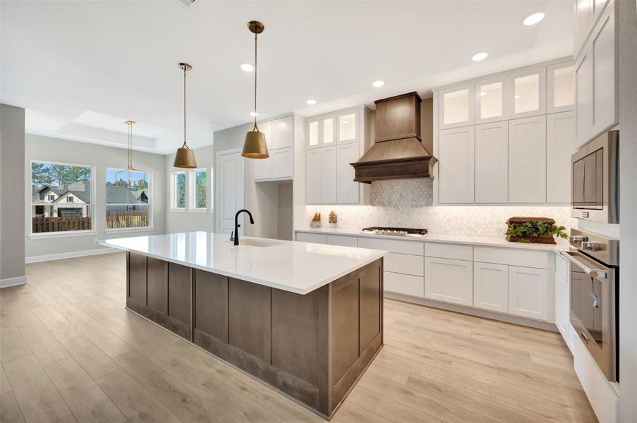 Designer Kitchen w/cabinets to ceiling, quartz counters & upgraded appliance package.