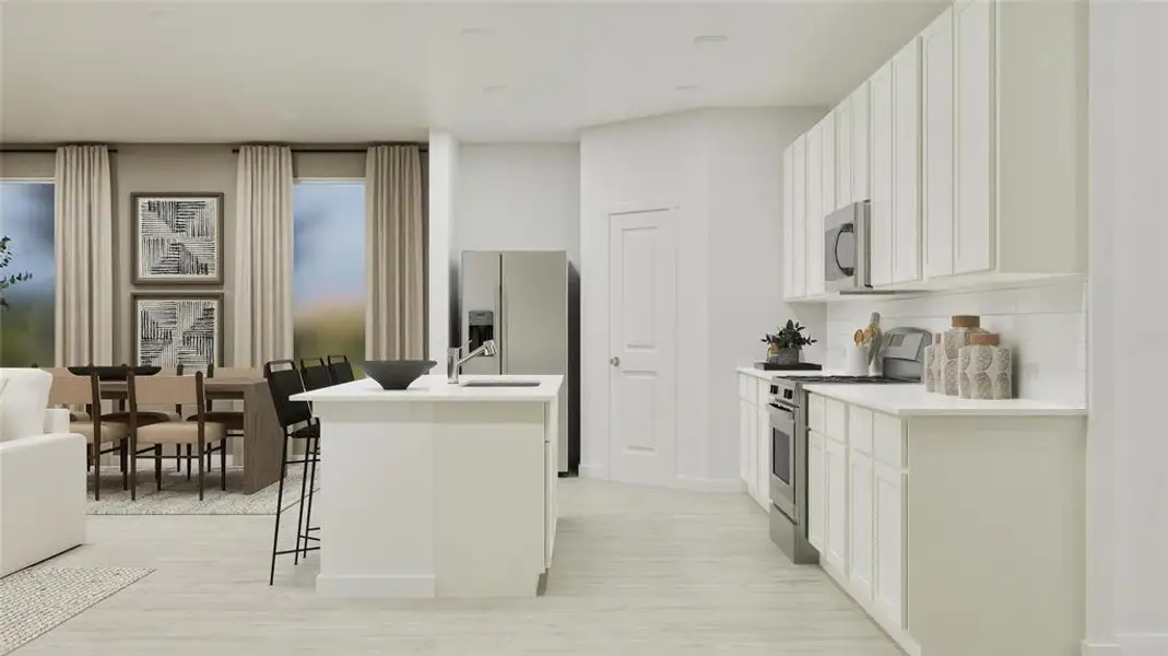 Kitchen with stainless steel appliances, backsplash, white cabinets, and a breakfast bar