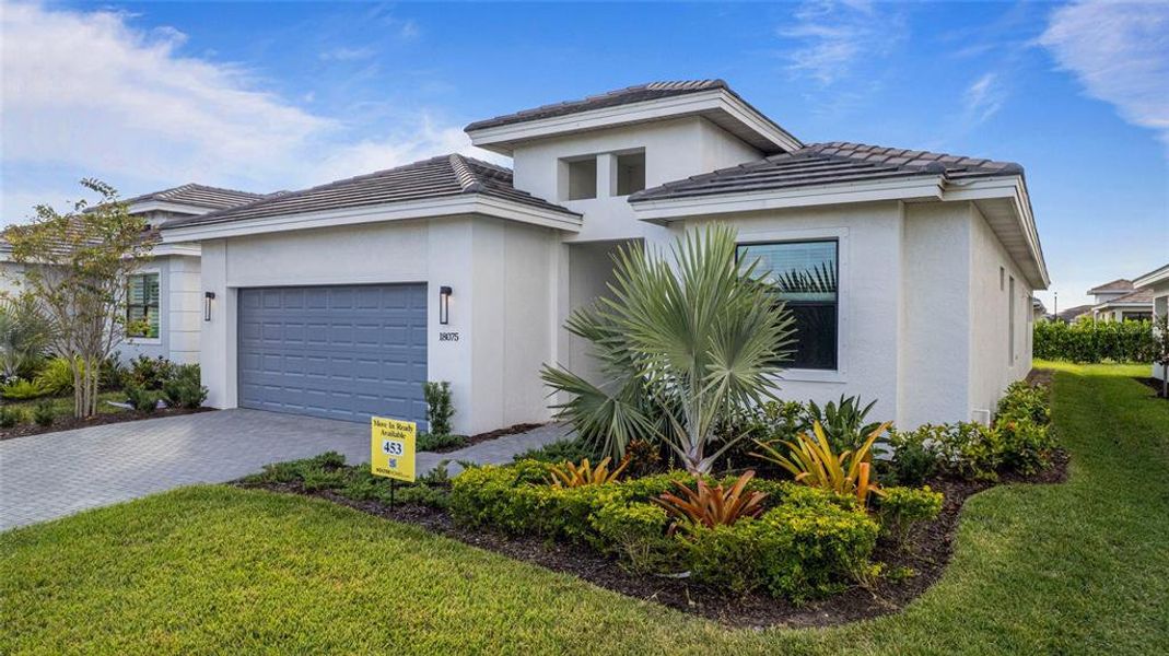 Front exterior of a new home in Cresswind Lakewood Ranch, Lakewood Ranch, FL, highlighting curb appeal (Image 20).