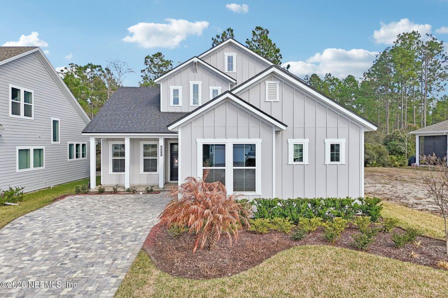 Front exterior of a new home in Middlebourne, St. Johns, FL, highlighting curb appeal (Image 31). Front exterior of a new home in Middlebourne, St. Johns, FL, highlighting curb appeal (Image 31).