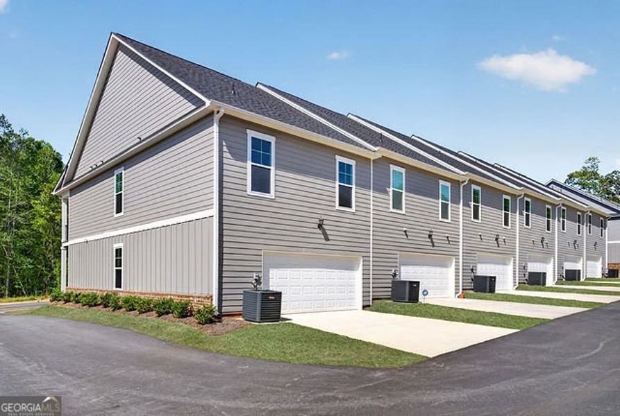 Front exterior of a new home in The Park at Gainesville Township, Gainesville, GA, highlighting curb appeal (Image 16).