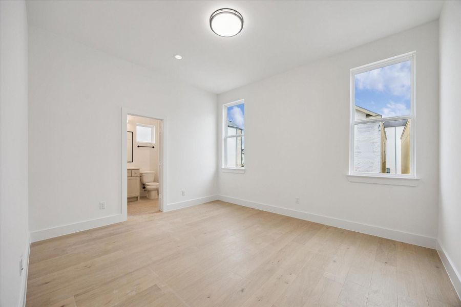 Comfortable secondary bedroom offering a versatile layout—ideal for guests, family, or a personalized retreat on third floor