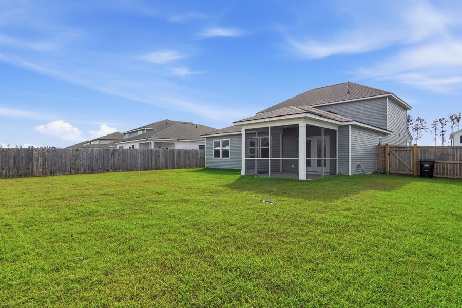 Exterior details and patio area of a home in Sanctuary Cove at Cane Bay, Summerville (Image 33).