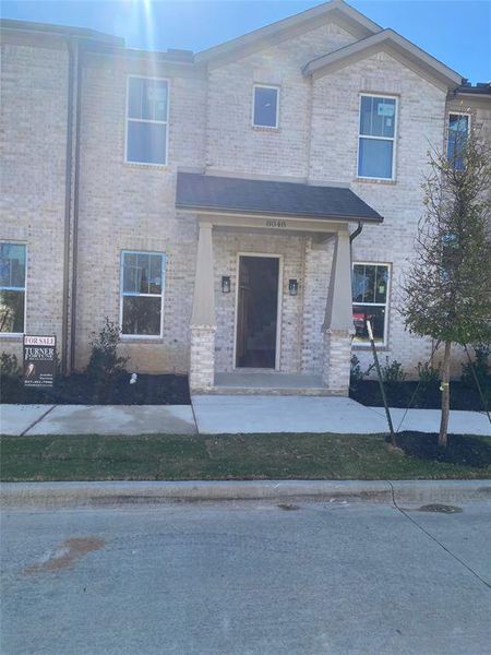 View of property featuring a porch