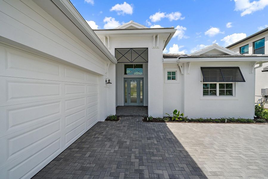 Exterior details and patio area of a home in L'Ambiance at Avenir, Palm Beach Gardens (Image 3).