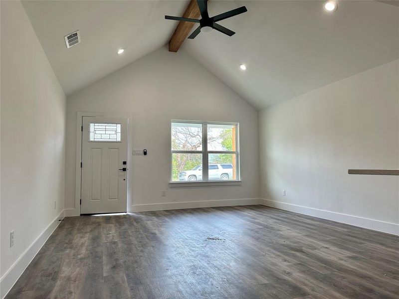 Entrance foyer featuring beam ceiling, dark wood-type flooring, ceiling fan, high vaulted ceiling, and recessed lighting Entrance foyer featuring beam ceiling, dark wood-type flooring, ceiling fan, high vaulted ceiling, and recessed lighting