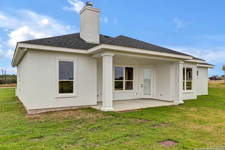 Front exterior of a new home in , La Vernia, TX, highlighting curb appeal (Image 26). Front exterior of a new home in , La Vernia, TX, highlighting curb appeal (Image 26).