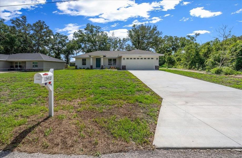 Front exterior of a new home in , Belleview, FL, highlighting curb appeal (Image 22).