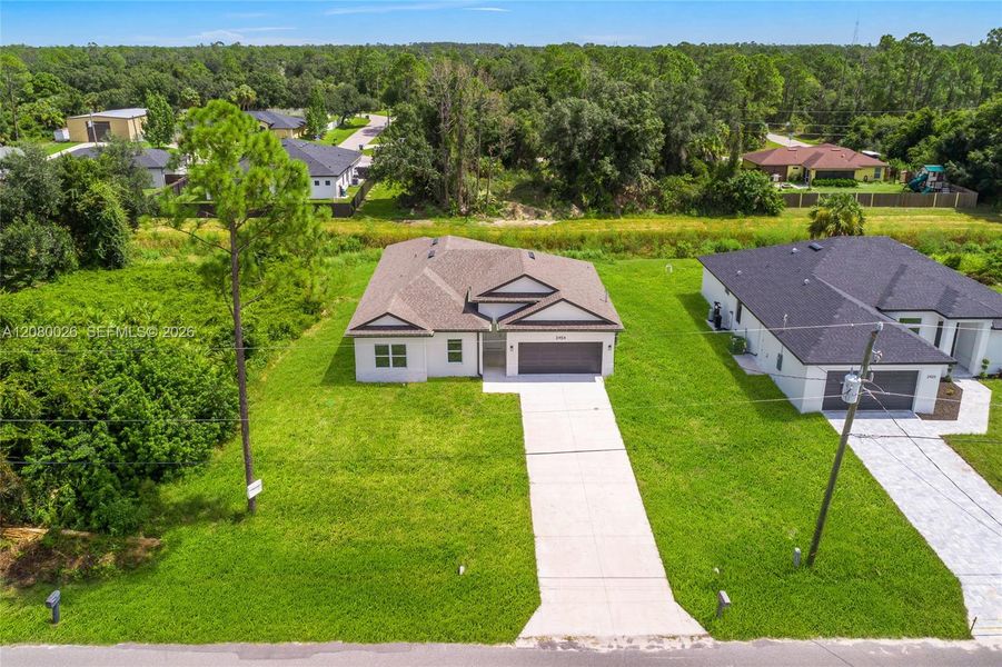 Front exterior of a new home in , North Port, FL, highlighting curb appeal (Image 17). Front exterior of a new home in , North Port, FL, highlighting curb appeal (Image 17).