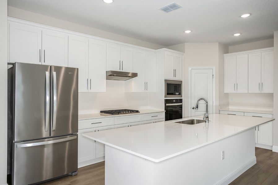 Furnished interior view inside a new home in Pasadena Woods, Dade City (Image 3).