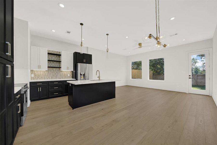 Another view of the kitchen/living area