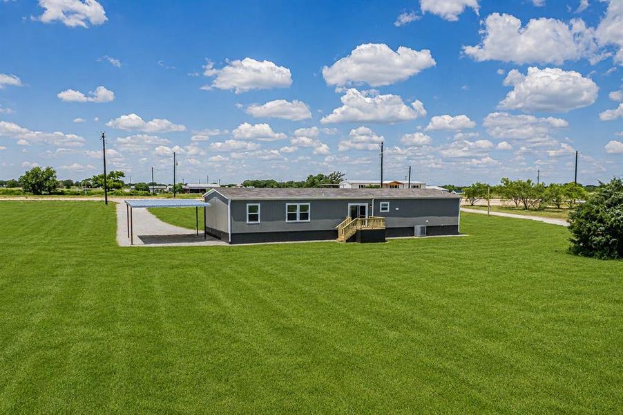 Exterior details and patio area of a home in , Poolville (Image 24).