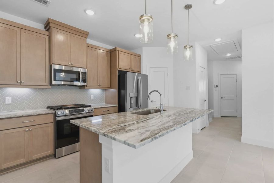 Representative furnished interior of a home built from the Carriagehouse by Chesmar Homes in Meridiana Townhomes, Iowa Colony (Image 12).