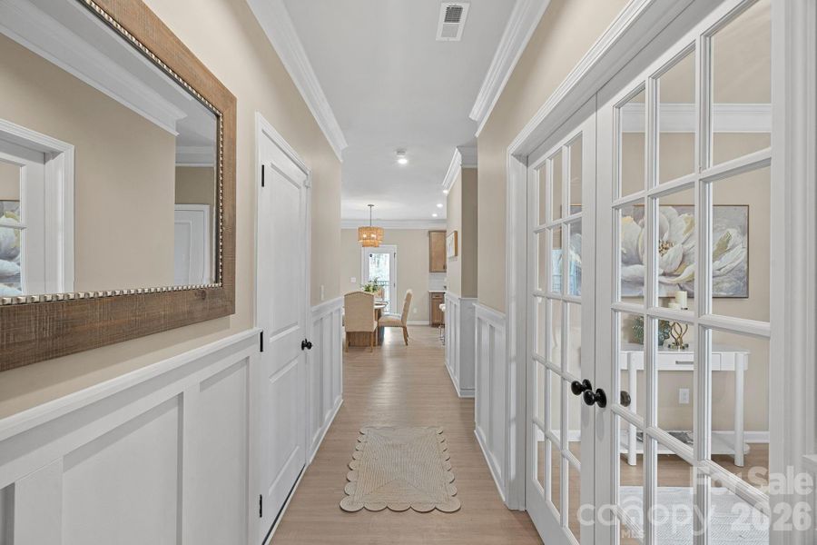 From the moment you enter, you are met with detail like custom wainscoting, crown molding. From the moment you enter, you are met with detail like custom wainscoting, crown molding.