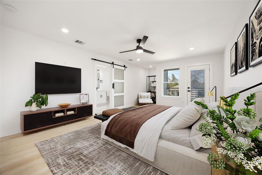 Inviting primary suite featuring a ceiling fan, generous layout, and access to a private balcony, along with an en-suite bath for added comfort and convenience. *Virtually Staged Inviting primary suite featuring a ceiling fan, generous layout, and access to a private balcony, along with an en-suite bath for added comfort and convenience. *Virtually Staged