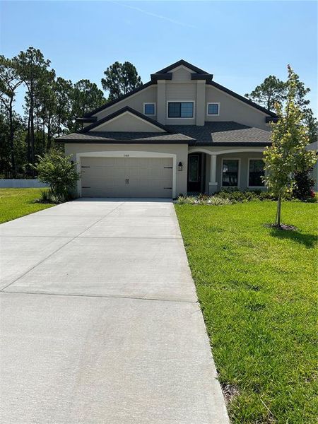 Front with long driveway