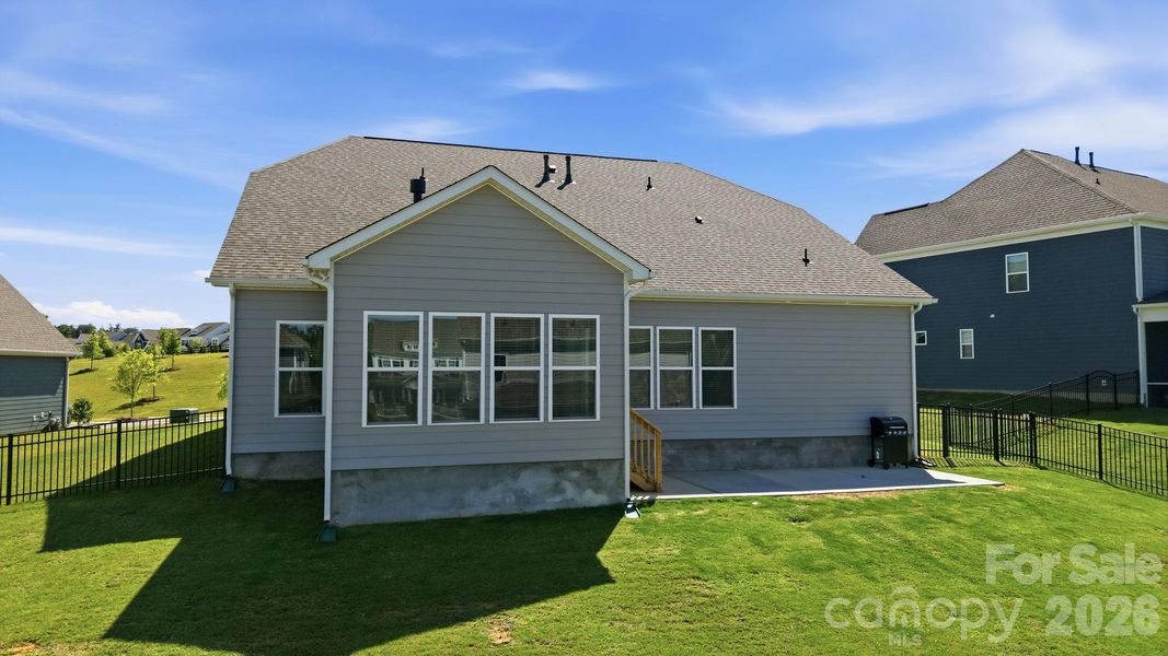 Exterior details and patio area of a home in Estates at Sugar Creek, Indian Land (Image 31).