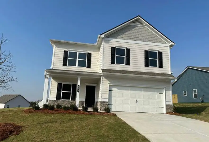 Front exterior of a new home in The Stiles, Cartersville, GA, highlighting curb appeal (Image 1). Front exterior of a new home in The Stiles, Cartersville, GA, highlighting curb appeal (Image 1).