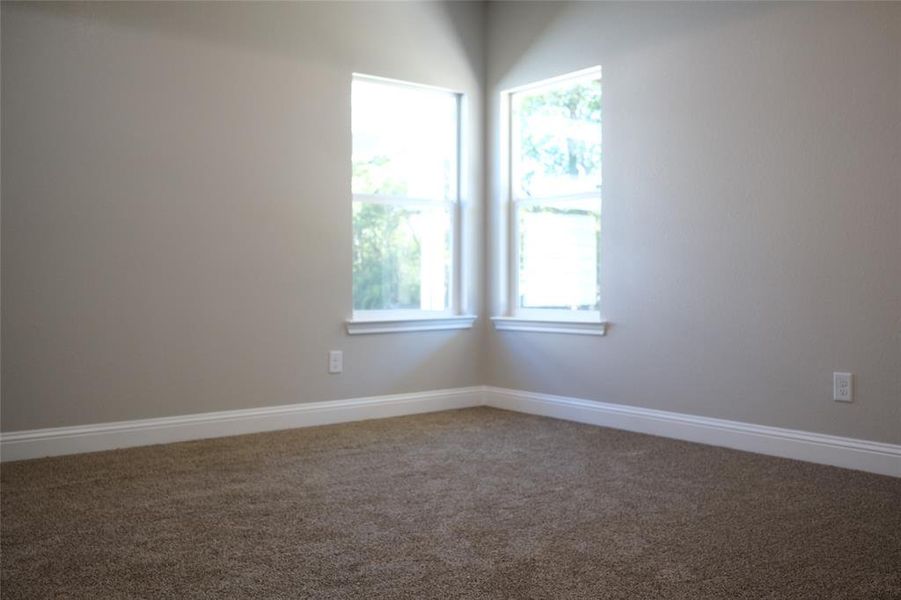 Second room featuring baseboards and carpet Second room featuring baseboards and carpet