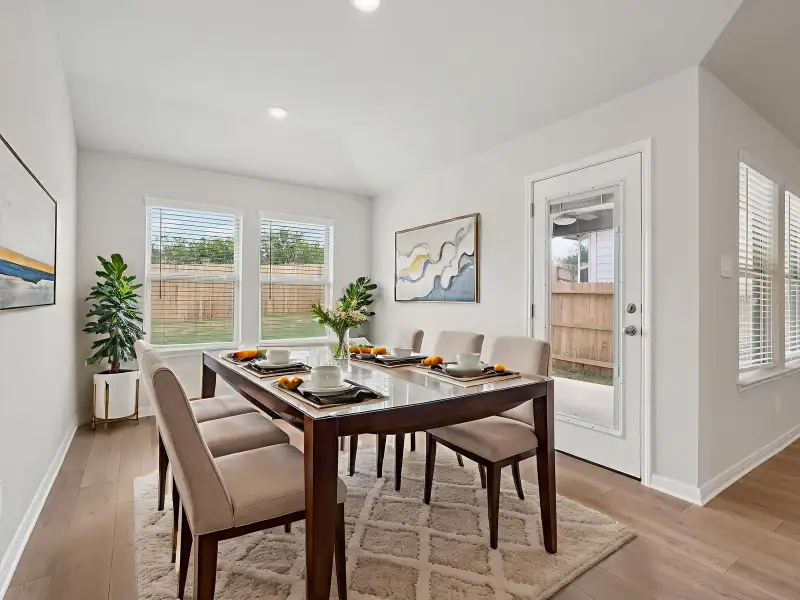 Virtually staged dining room in the Briscoe floorplan at a Meritage Homes community. Virtually staged dining room in the Briscoe floorplan at a Meritage Homes community.