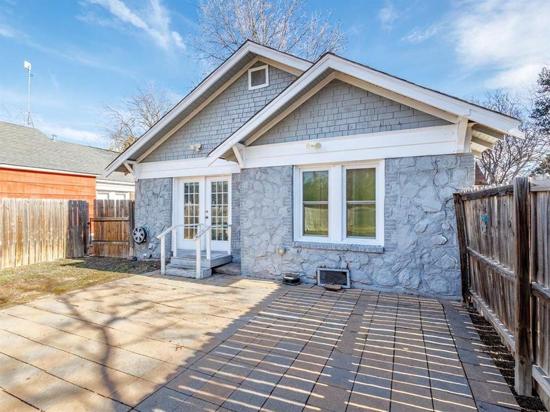 Backyard pavers offers space for outdoor furniture and cooking