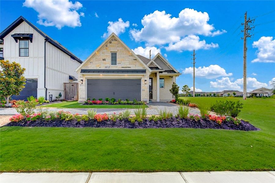 Front exterior of a new home in Jordan Ranch, Katy, TX, highlighting curb appeal (Image 2).
