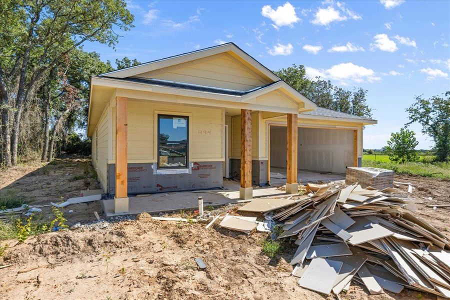Front exterior of a new home in , Tolar, TX, highlighting curb appeal (Image 9).
