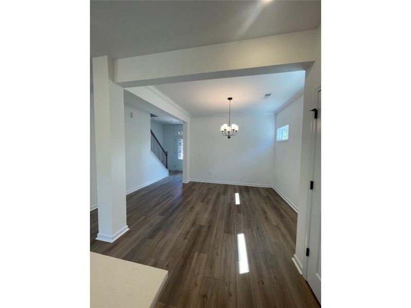 This versatile living space features warm flooring