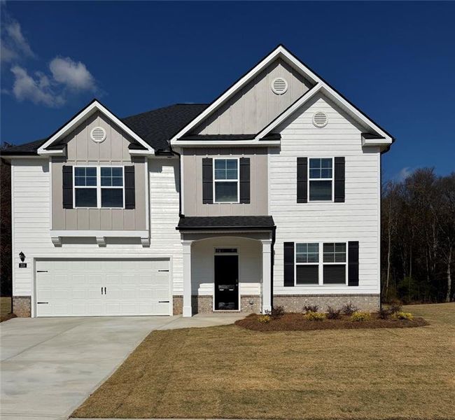 Front exterior of a new home in Jackson Landing, Jefferson, GA, highlighting curb appeal (Image 1).