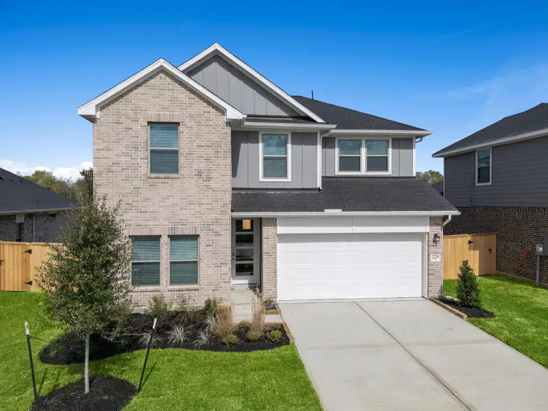 Front exterior of a new home in Laurel Landing, Alvin, TX, highlighting curb appeal (Image 1). Front exterior of a new home in Laurel Landing, Alvin, TX, highlighting curb appeal (Image 1).