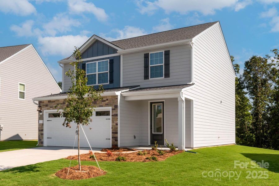 Front exterior of a new home in Village at Granite, Salisbury, NC, highlighting curb appeal (Image 2). Front exterior of a new home in Village at Granite, Salisbury, NC, highlighting curb appeal (Image 2).